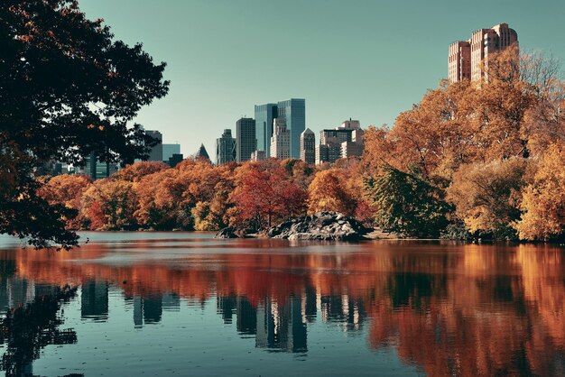 Central Park Autumn and buildings reflection in midtown Manhattan New York City