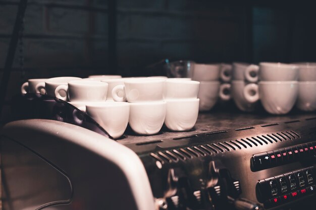 Ceramic cups on coffee machine