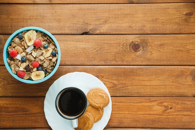 Cereal and coffee cup with cookies