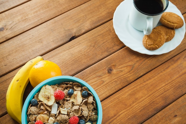 Cereal and coffee with cookies