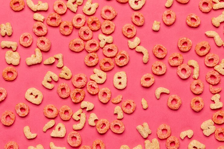 Free Photo cereal fruit loops and alphabet letters top view