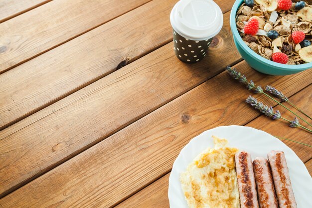 Cereal and omelette with sausages