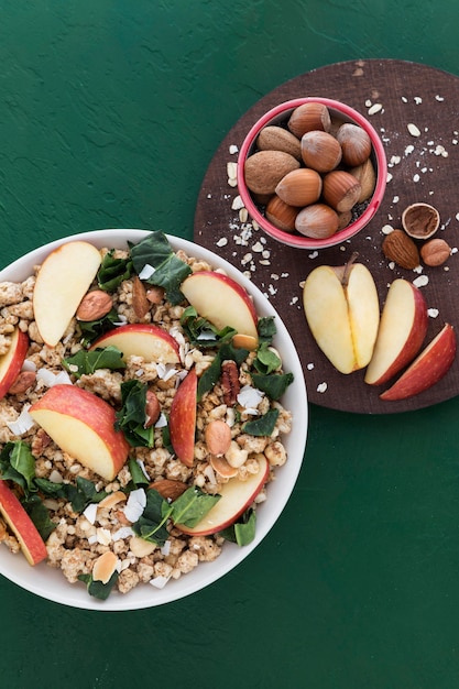 Cereals and slices of apple flat lay