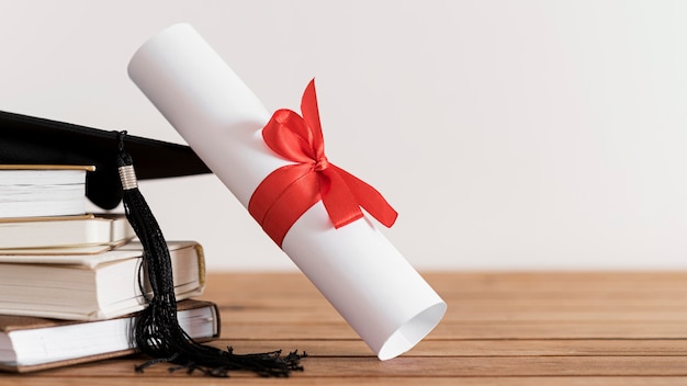 Certificate with ribbon and bow and books