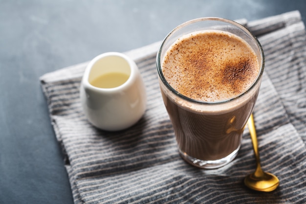 Chai latte in glass with milk