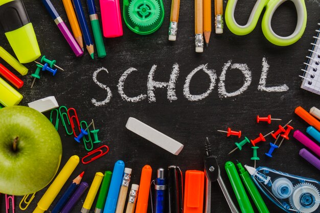 Chalk and blackboard with supplies