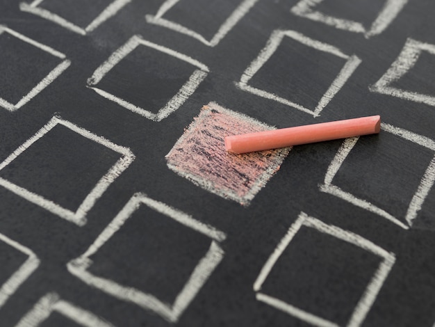 Chalk orange square surrounded by white contoured squares