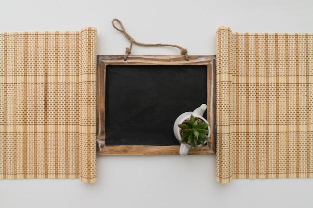 Chalkboard framed by two bamboo table runners