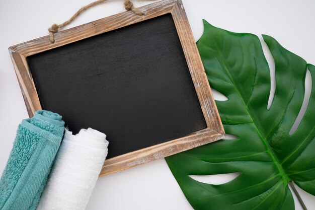 Chalkboard, leaf and towels