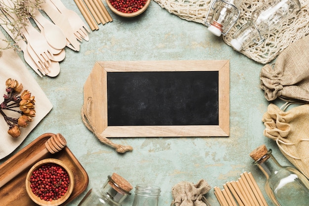 Free photo chalkboard mock-up with environment friendly objects