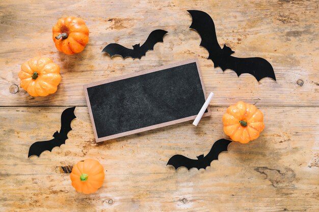 Chalkboard and paper bats with pumpkins