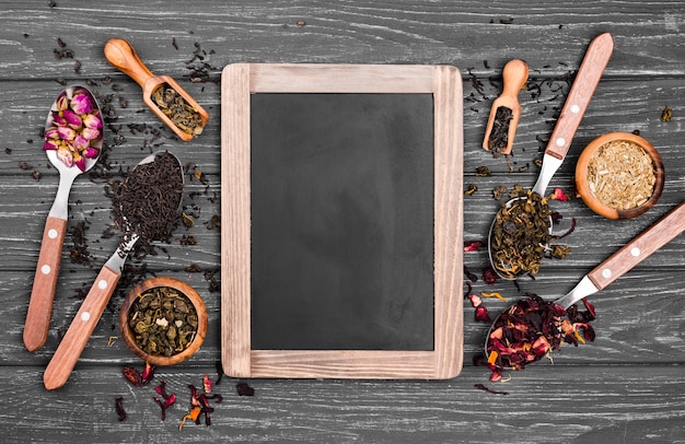 Chalkboard and spoons with herbal tea