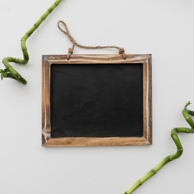 Chalkboard and two bamboo sticks