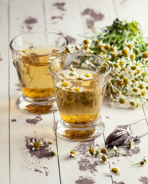 Chamomile tea cups and plants