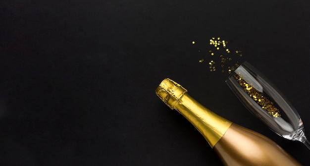 Free photo champagne bottle with copy-space