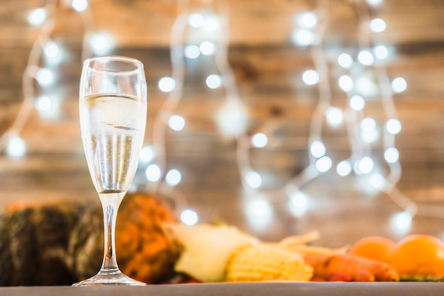 Champagne glass on table with vegetables