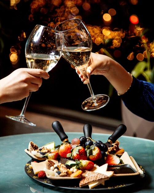 Champagne glasses and fruit plate