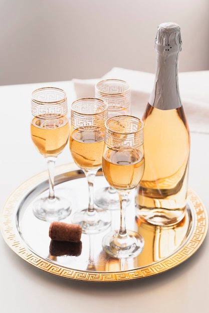 Free photo champagne glasses on a tray