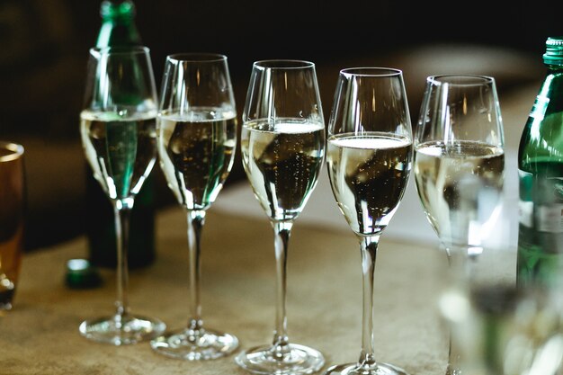 Champagne sparkles in the crystal glasses 