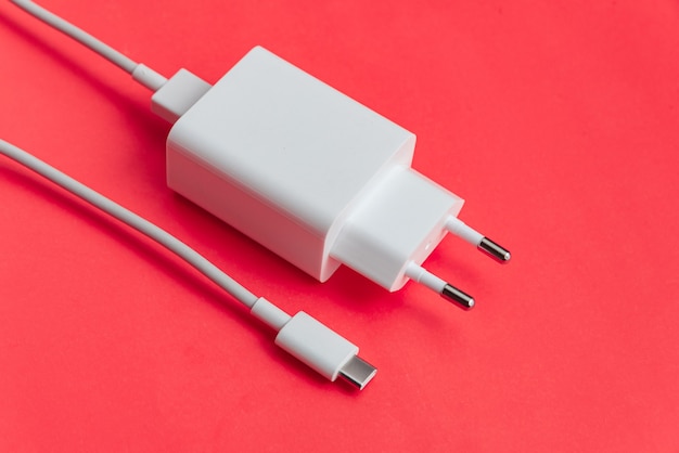 Free photo charger and usb cable type c over orange background