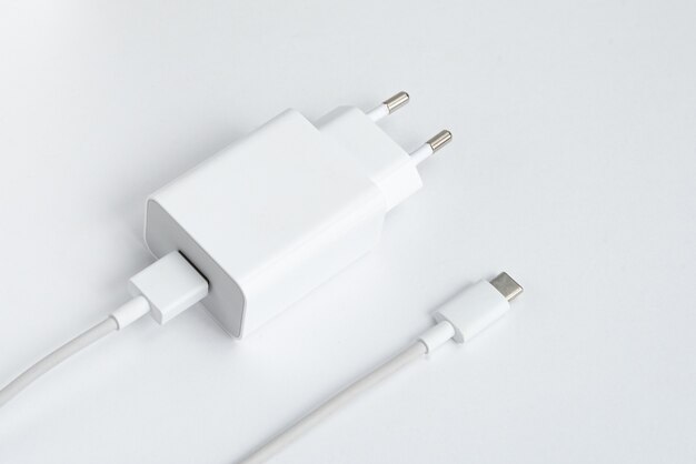 Charger and USB cable type C over white isolated background