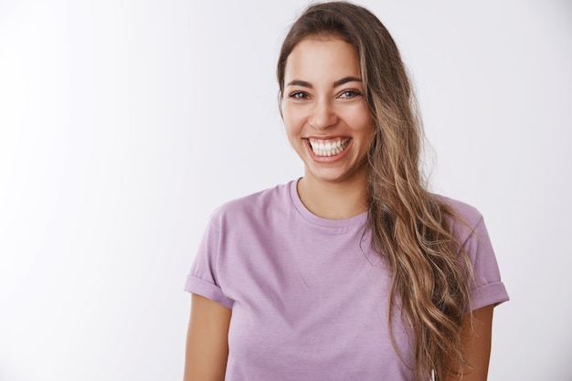 Free photo charismatic carefree attractive healthy woman laughing out loud smiling white teeth giggling having fun, enjoying awesome friendly company watching comedy, chuckling funny joke, white wall