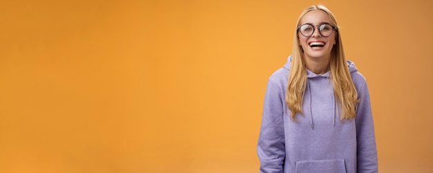 Charismatic joyful charming smiling female university straight a student in glasses purple cozy hood