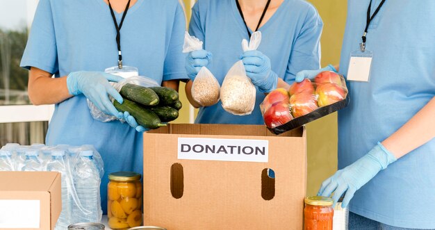 Charity box being prepared with food for donation