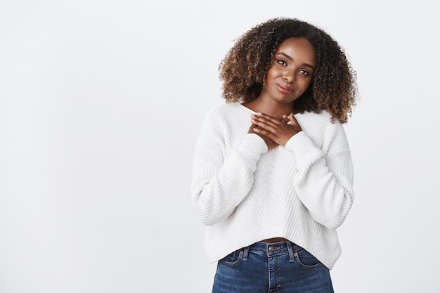 Charming african-american girlfriend receive present press palm heart thankful grateful gesture tilt head smiling appreciate support love, care, white background.