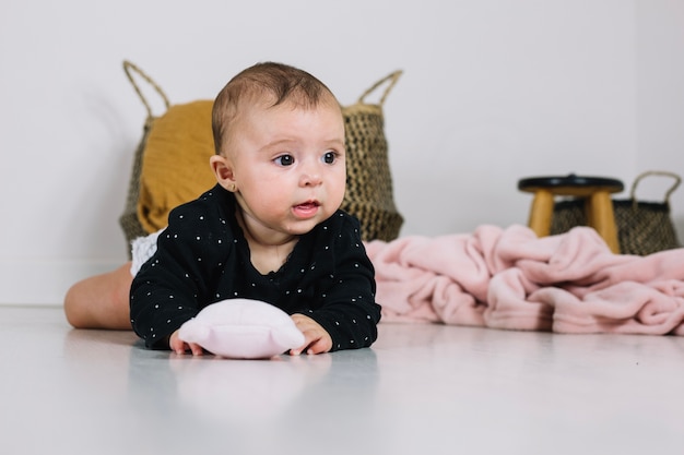 Charming baby with toy