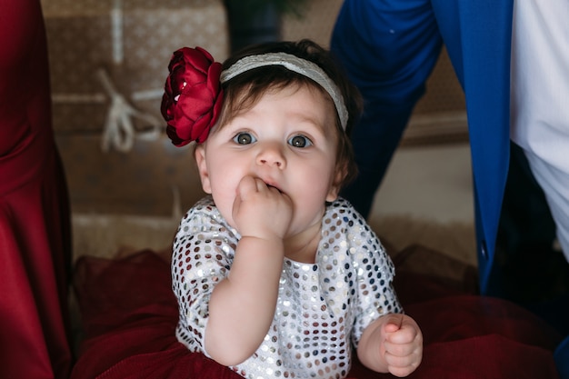 Free photo the charming child sitting on the bed