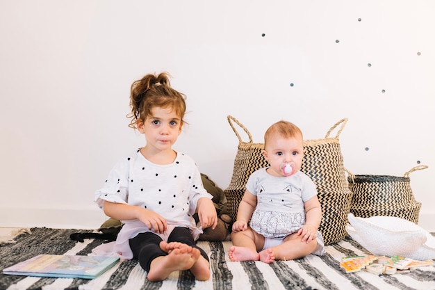 Charming children on striped rag