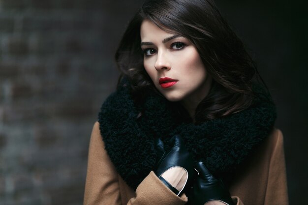 Charming fashion female model in a coat.