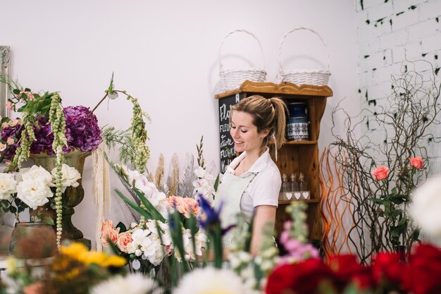 Charming florist in flower shop