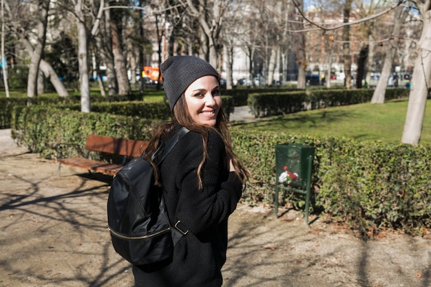 Charming girl in black outfit on street