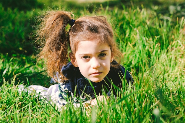Charming girl in grass