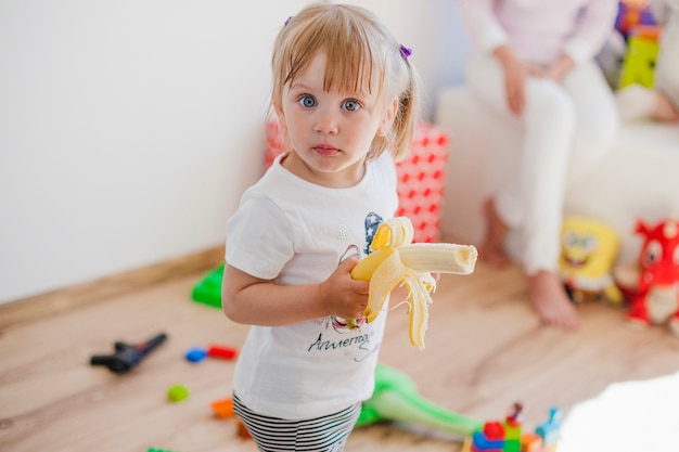 Charming girl with banana