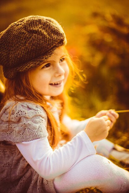 Charming little girl in a cap 