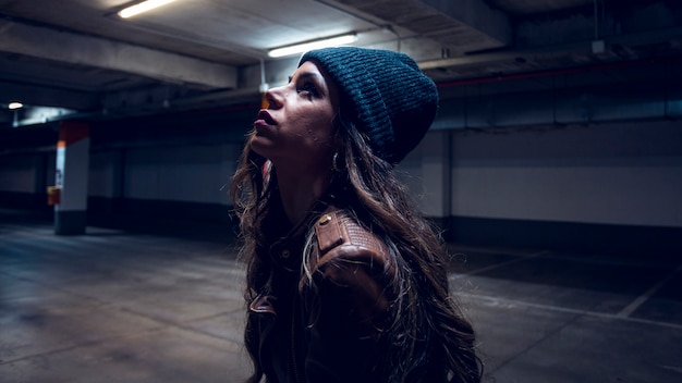 Charming woman in underground parking lot