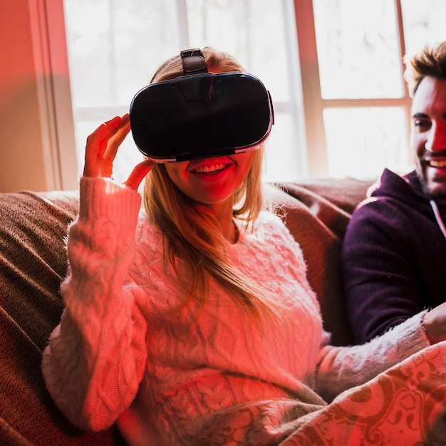 Free photo charming woman in vr glasses near boyfriend