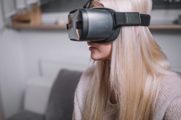Charming woman in VR goggles