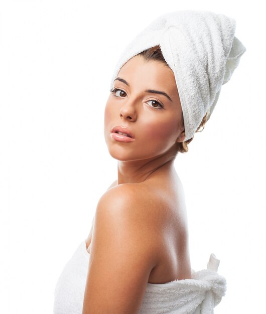 Charming woman wearing white towel