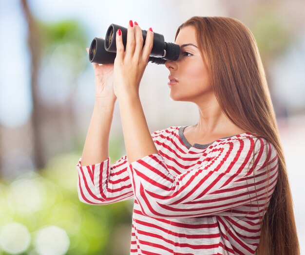 Charming woman with binoculars