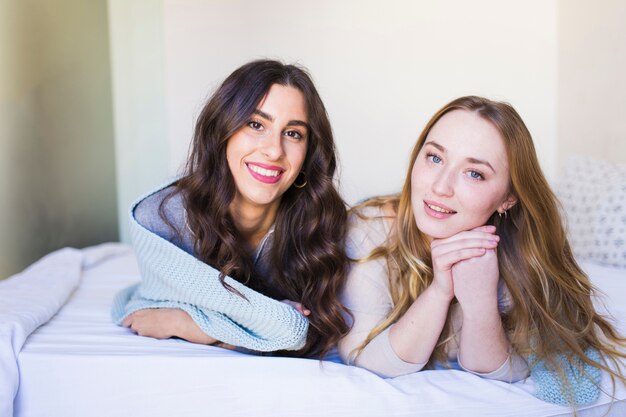 Charming women on bed