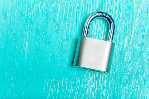 Check-lock on the wooden table background