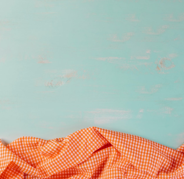 Checkered tablecloth on blue background