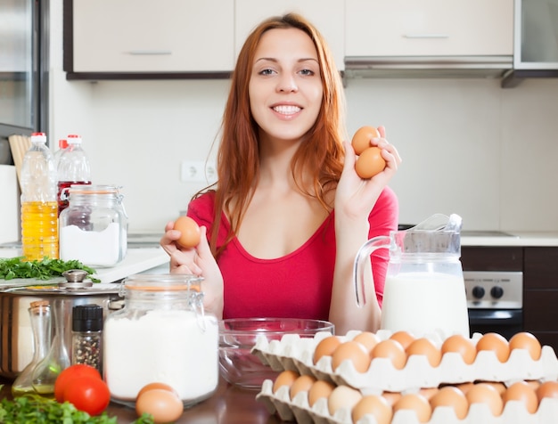 Cheeful woman in red with eggs