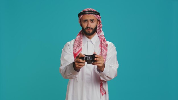 Free photo cheerful adult playing videogames