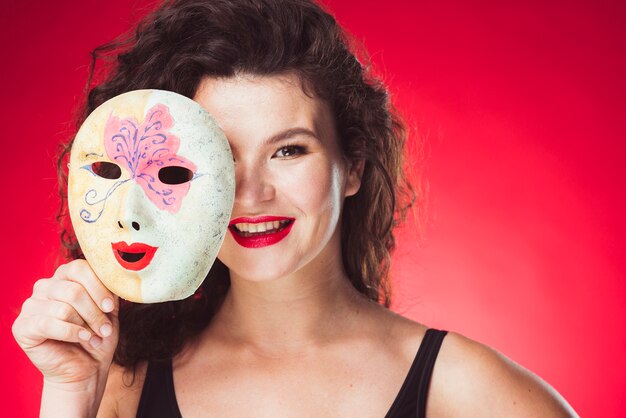 Cheerful adult woman with mask