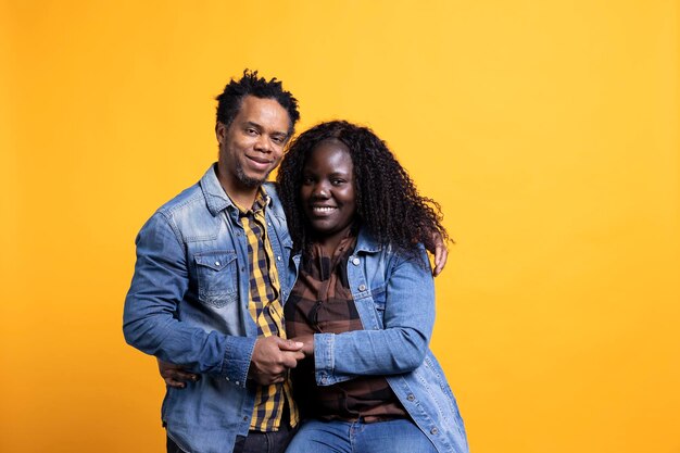 cheerful african american soulmates hugging each other in studio